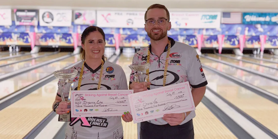 Chris Via and Bryanna Coté standing with trophies after winning the 2025 Striking Against Breast Cancer Mixed Doubles