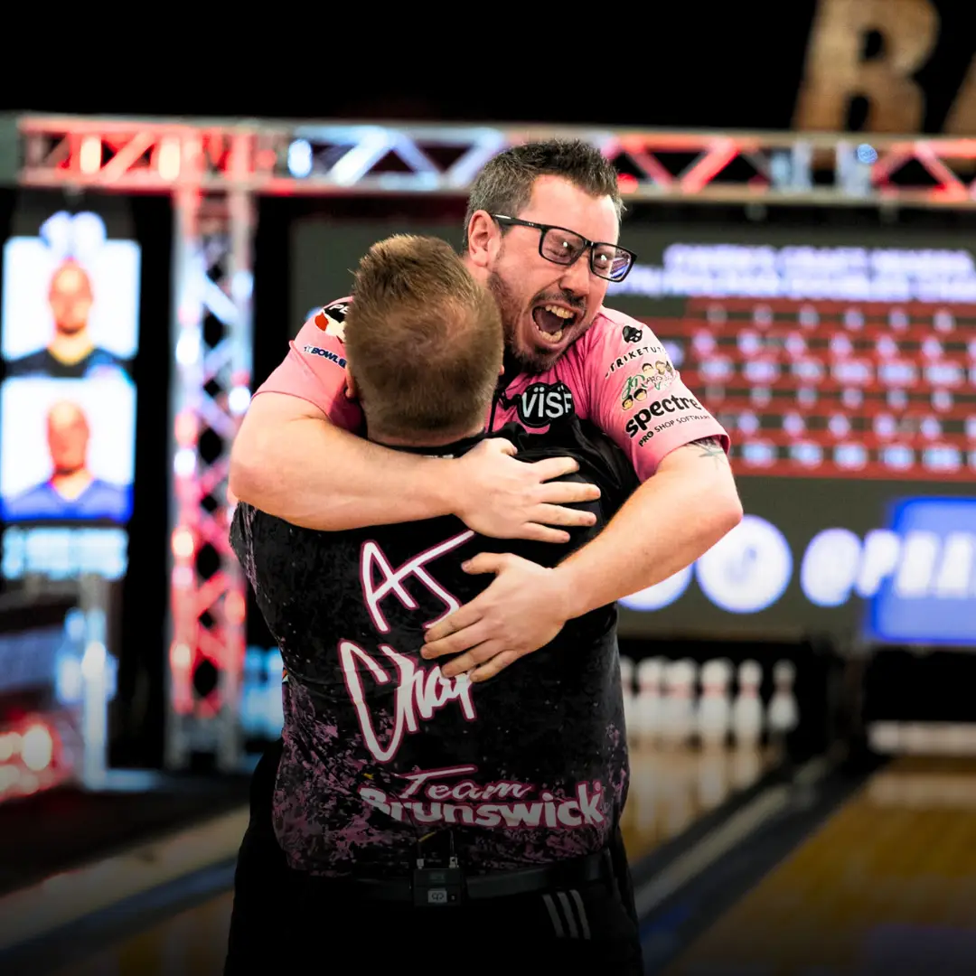 Zach Wilkins and AJ Chapman celebrating with the Roth/Holman Doubles Championship trophy at Bayside Bowl in Portland, Maine