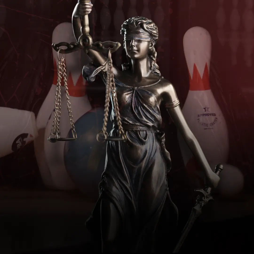 Lady Justice statue with scales in front of bowling pins, representing a legal case involving the bowling industry.