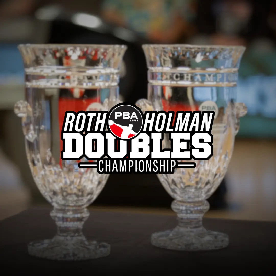 PBA Roth Holman Doubles Championship trophies standing on a table on the bowling lane.